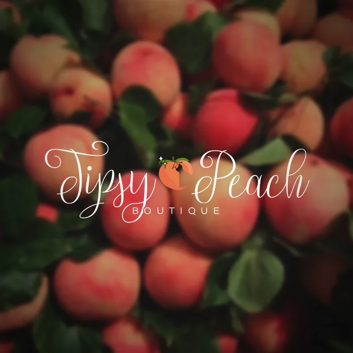 Tipsy Peach Boutique logo in white over a photograph of ripe peaches